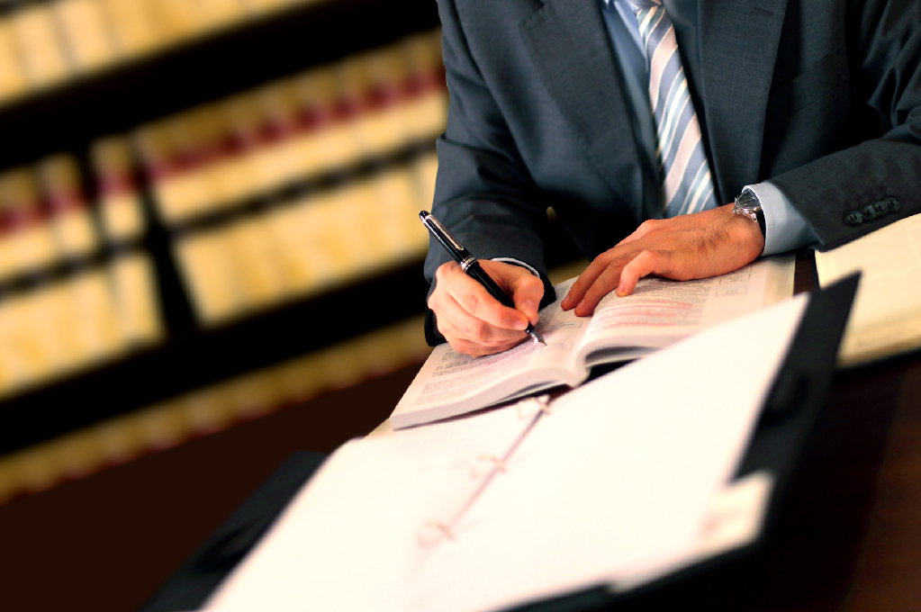 Lawyer in law library working on documents